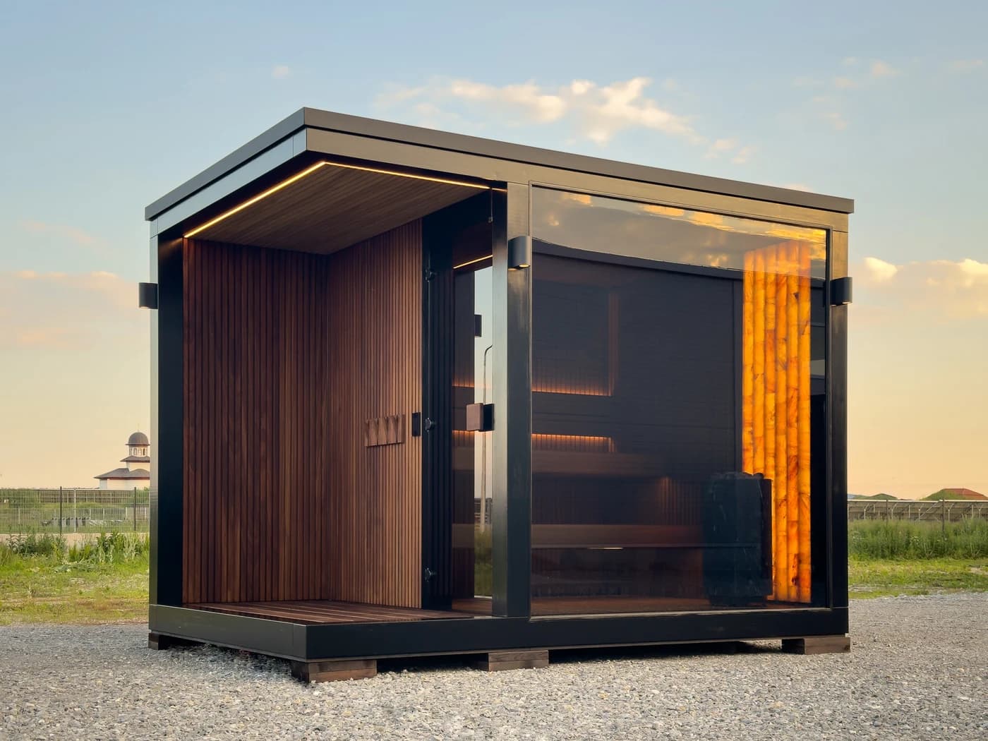Built MODUM sauna with timber cladding, glass front and a small covered terrace